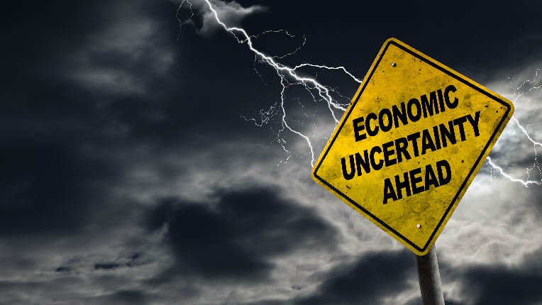 Street sign saying Economic Uncertainty Ahead