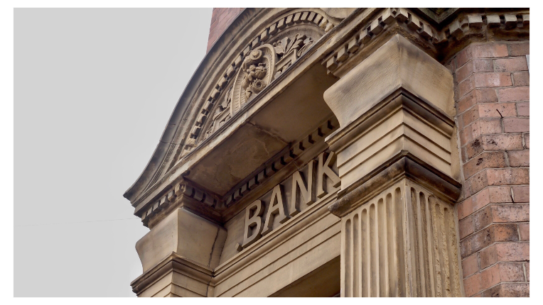 An old building with the word Bank on it
