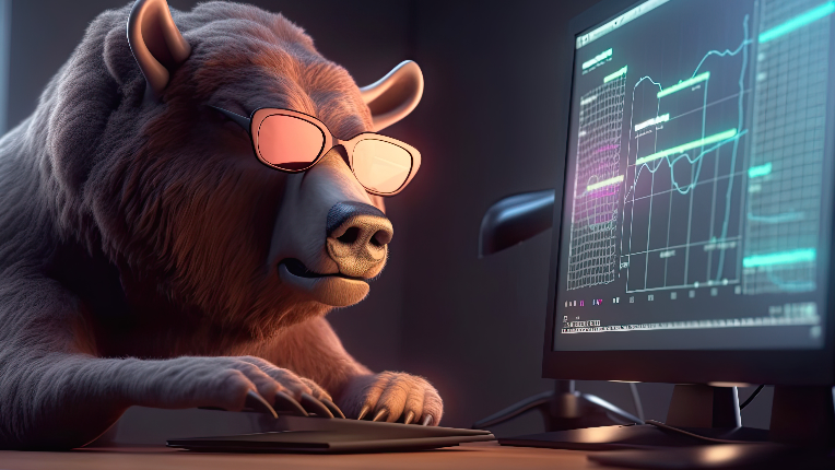 Bear wearing sunglasses looking at graphs on computer