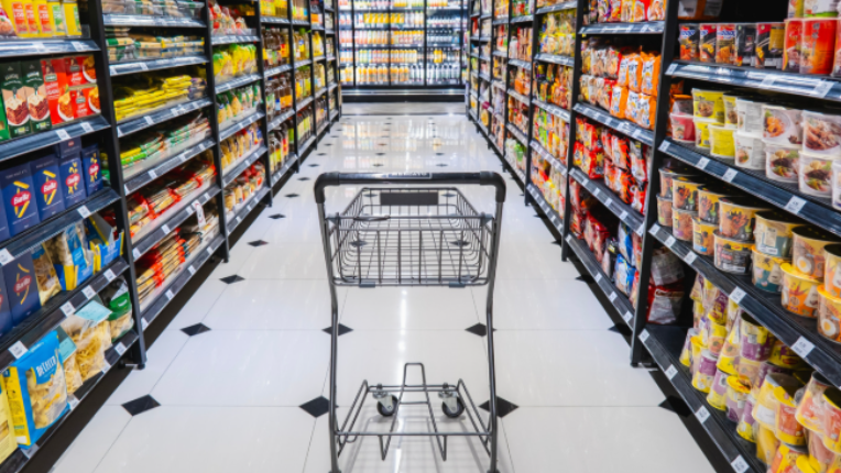 picture of shopping cart in grocery aisle