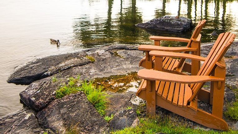 Muskoka chairs by the lake