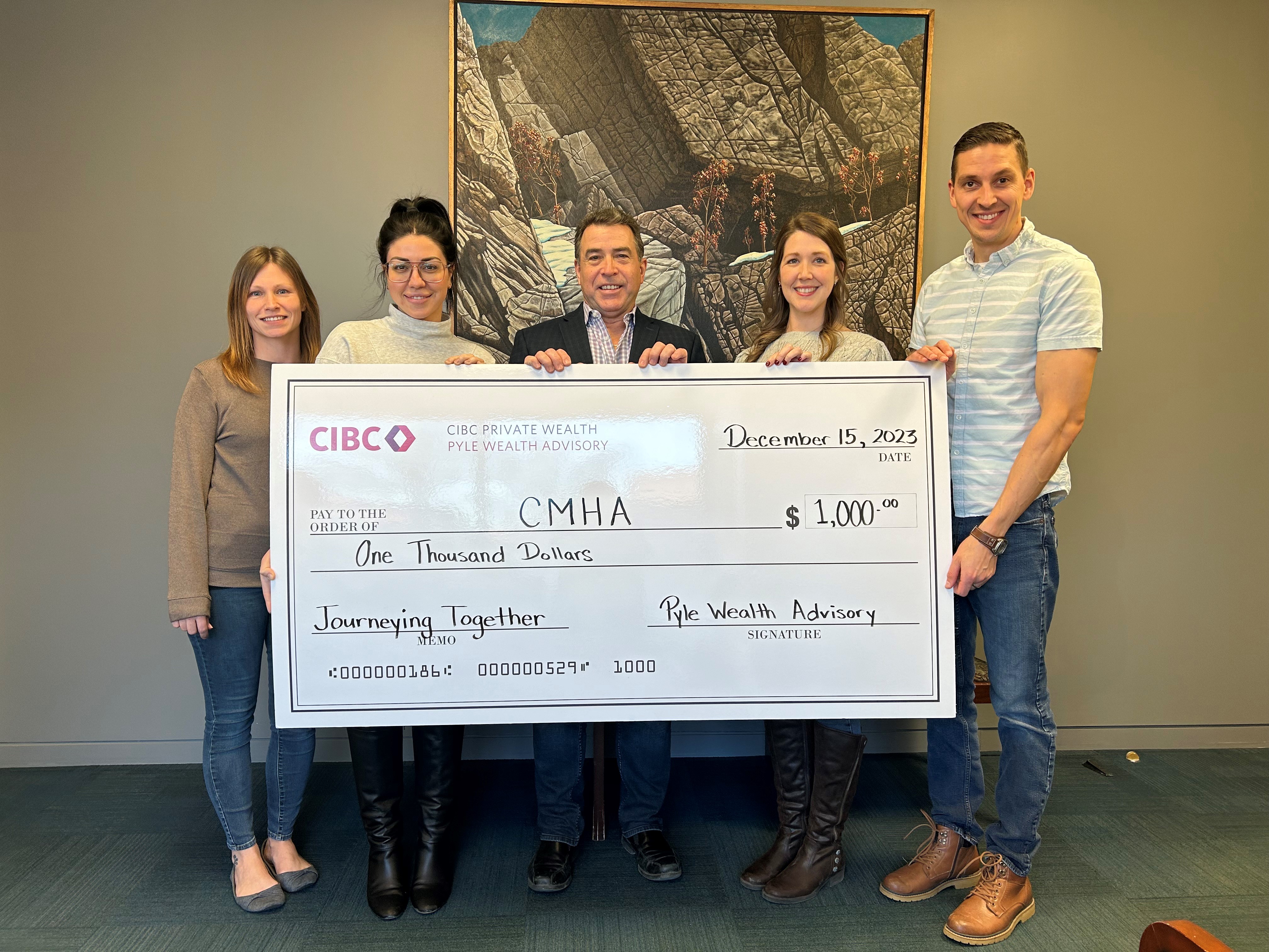 Team photo presenting cheque for CMHA.
